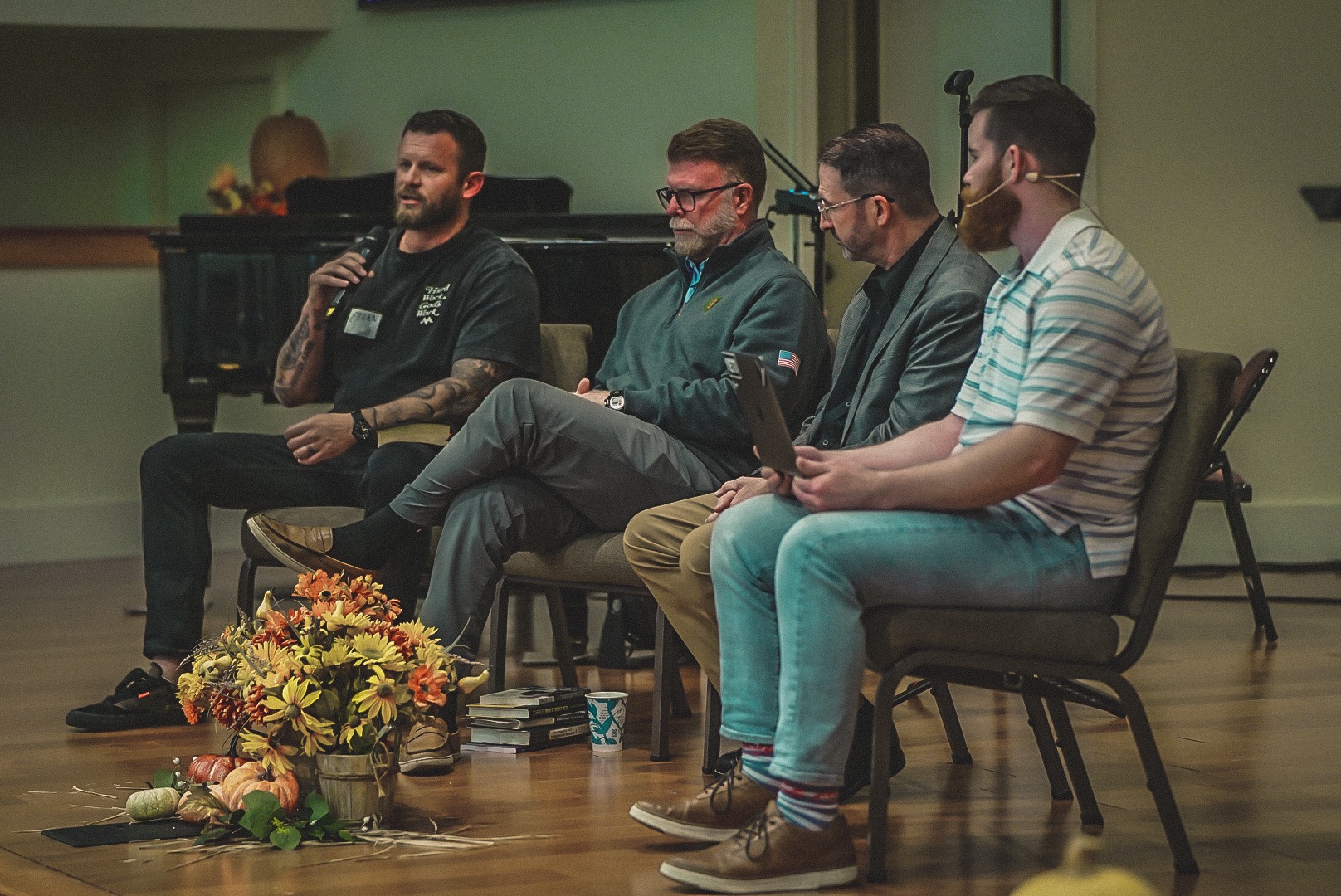 Todd Leonard seated on a panel with other men at a Micah Mandate gathering